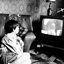 Boy watching television in a London house, c1950s. Creator: Henry Grant