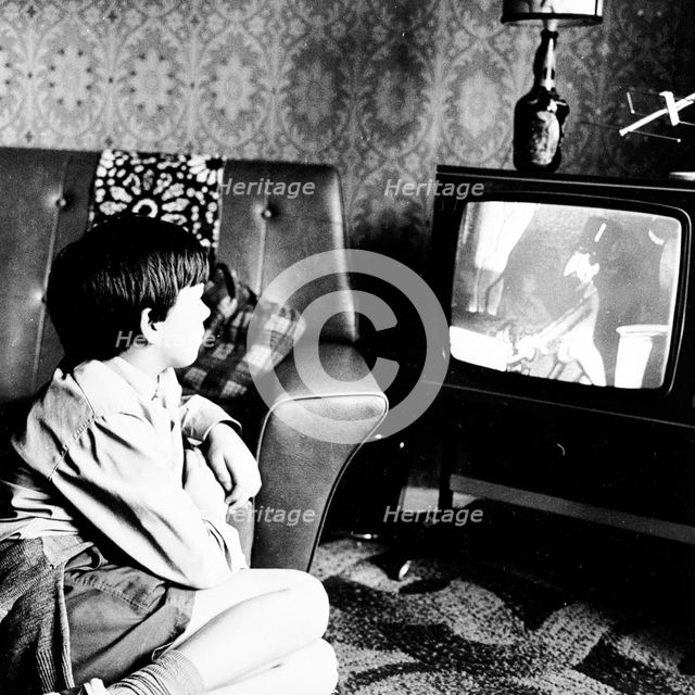 Boy watching television in a London house, c1950s. Creator: Henry Grant.