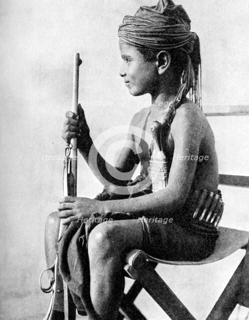 Boy with a gun, Aden Protectorate, Arabia, 1936. Artist: Fox