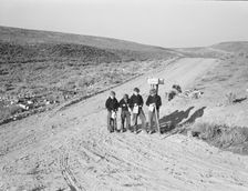 Boys wait for school bus in the morning, Malheur County, Oregon, 1939. Creator: Dorothea Lange