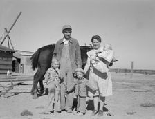 Boys wait for school bus in the morning, Malheur County, Oregon, 1939. Creator: Dorothea Lange