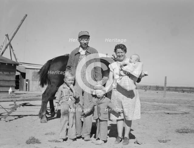 Boys wait for school bus in the morning, Malheur County, Oregon, 1939. Creator: Dorothea Lange.