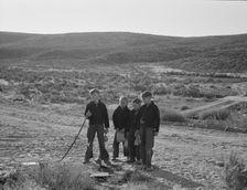 Boys wait for school bus in the morning, Malheur County, Oregon, 1939. Creator: Dorothea Lange