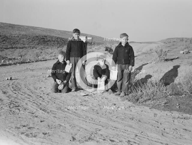 Boys wait for school bus in the morning, Malheur County, Oregon, 1939. Creator: Dorothea Lange.