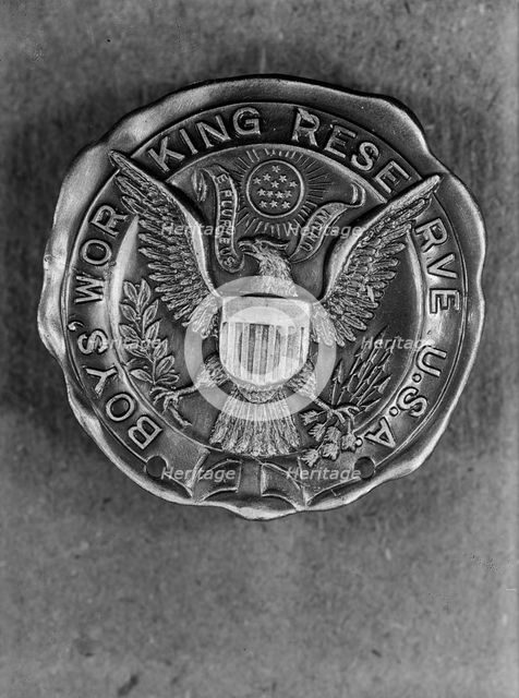 Boys Working Reserve, U.S.A. Badge, 1917. Creator: Harris & Ewing.