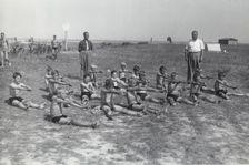 Boys doing exercises before having a swimming lesson, Sweden, 1939. Creator: Otto Ohm