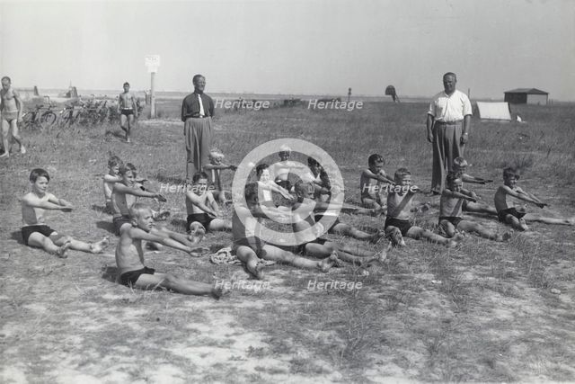 Boys doing exercises before having a swimming lesson, Sweden, 1939. Creator: Otto Ohm.
