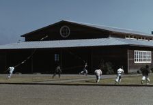 Boys flying a kite in front of community center, FSA ... camp, Robstown, Tex., 1942. Creator: Arthur Rothstein