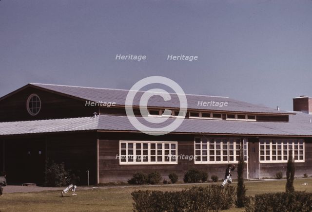 Boys flying a kite in front of the community center, FSA camp, Robstown, Tex., 1942. Creator: Arthur Rothstein.