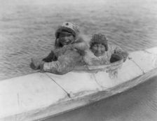 Boys in a kaiak (i.e., kayak)-Nunivak, c1929. Creator: Edward Sheriff Curtis