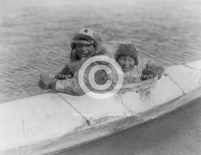 Boys in a kaiak (i.e., kayak)-Nunivak, c1929. Creator: Edward Sheriff Curtis.