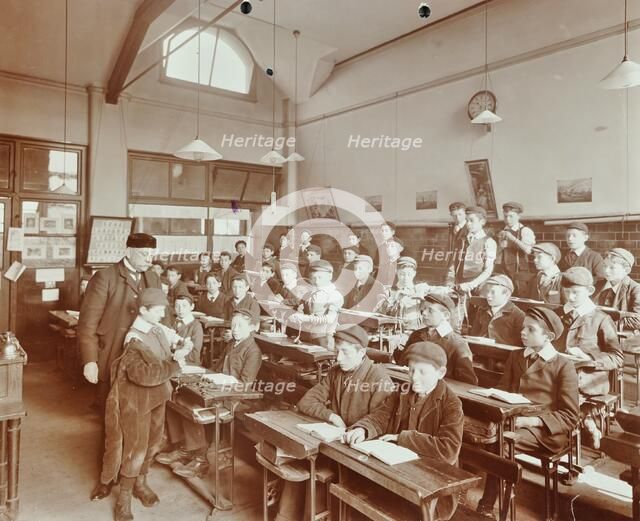 Boys laying the phylacteries, Jews' Free School, Stepney, London, 1908. Artist: Unknown.