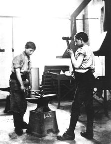 Boys learning blacksmith's skills, Jewish Free School, 1900-1910. Creator: Unknown