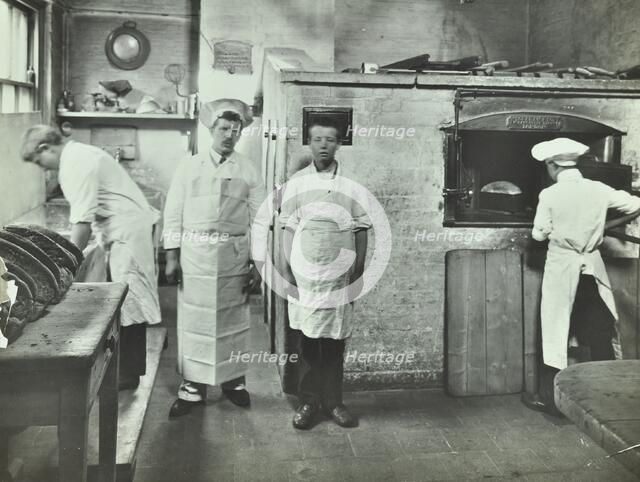 Boys making bread at Upton House Truant School, Hackney, London, 1908. Artist: Unknown.