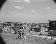 Boys overlooking the project, Frederick Douglass housing project, Anacostia, D.C., 1942. Creator: Gordon Parks