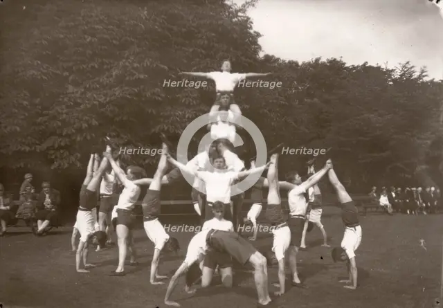 Boys pose in an outdoor gym lesson, 1929. Artist: Unknown