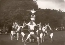 Boys pose in an outdoor gym lesson, 1929