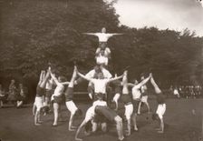 Boys pose in an outdoor gym lesson, 1929