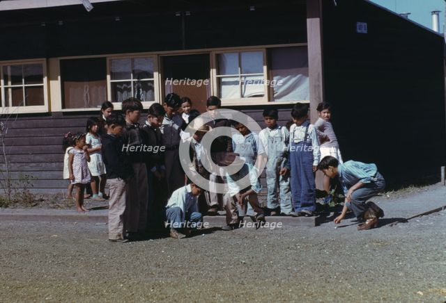 Boys playing marbles, FSA ... labor camp, Robstown, Texas, 1942. Creator: Arthur Rothstein.
