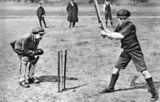 Boys playing cricket in Parliament Hill Fields, London, 1926-1927