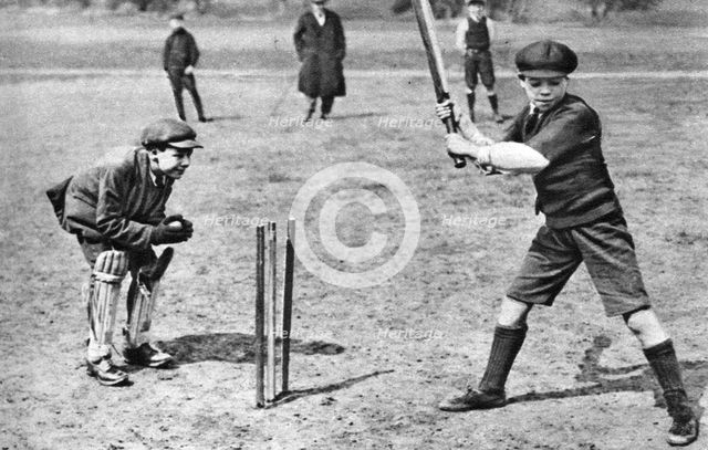Boys playing cricket in Parliament Hill Fields, London, 1926-1927. Artist: Unknown
