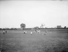 Boys playing cricket, with Thame windmill in the background, Thame, Oxfordshire, c1860-c1922. Artist: Henry Taunt