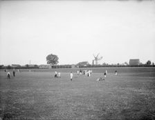 Boys playing cricket, with Thame windmill in the background, Thame, Oxfordshire, c1860-c1922. Artist: Henry Taunt