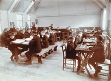 Boys playing dominoes and reading at the Boys Home Industrial School, London, 1900