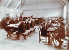 Boys playing dominoes and reading at the Boys Home Industrial School, London, 1900