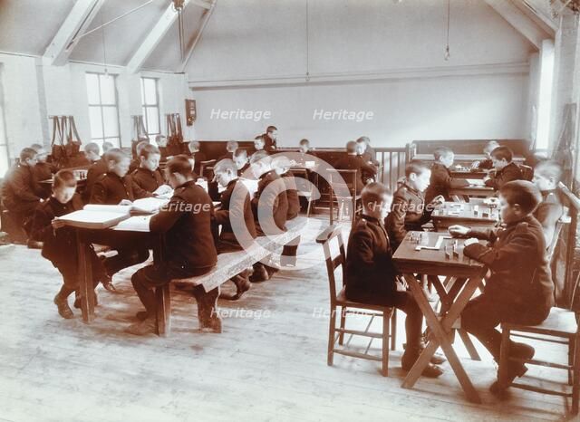 Boys playing dominoes and reading at the Boys Home Industrial School, London, 1900. Artist: Unknown.