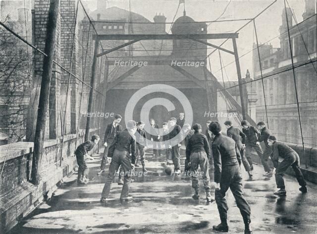 Boys playing football on the roof of St Paul's Cathedral Choir School, London, c1901 (1901). Artist: Unknown.