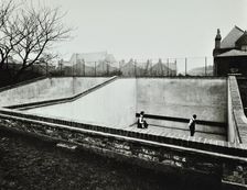 Boys playing in a fives court, Strand School, London, 1914