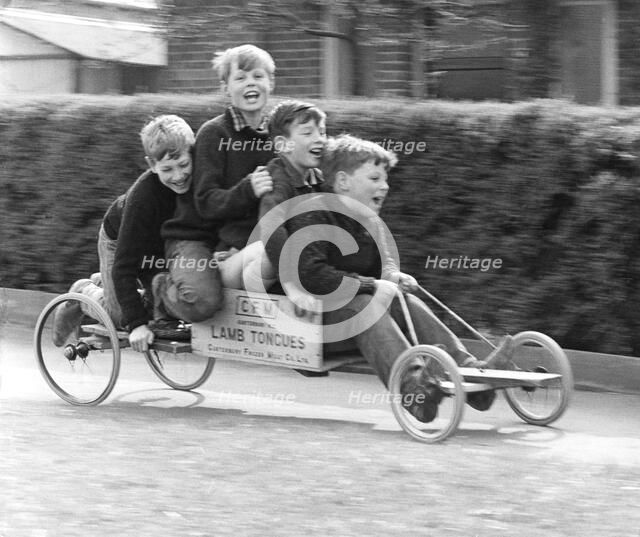 Boys playing with a home-made go-kart, Horley, Surrey, 1965.