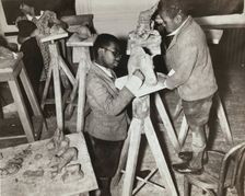 Boys sculpting a horse, Harlem Community Art Center, 1937. Creator: Solomon Horn