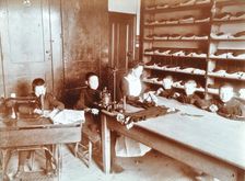 Boys sewing at the Boys Home Industrial School, London, 1900