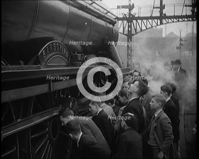 Boys Staring at a Steam Locomotive, 1931. Creator: British Pathe Ltd.