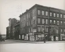 Boarded residential building on the corner of Madison Avenue and East 133rd Street..., 1938. Creator: Aubrey Pollard