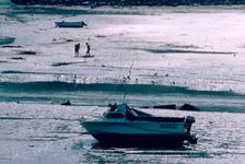 Boat at low tide, Port-en-Bessin, Normandy, France. Creator: Peter Thompson