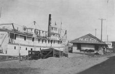 Boat docked at N.C. Co., between c1900 and 1916. Creator: Unknown