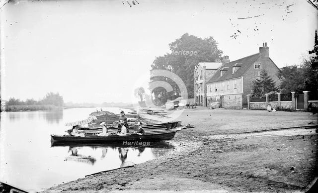 Boats moored on the River Thames near the Anglers Hotel at Walton-on-Thames, Surrey, c1860-c1922.  Artist: Henry Taunt