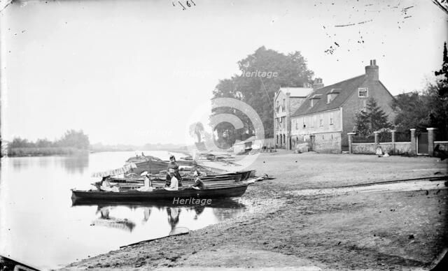 Boats moored on the River Thames near the Anglers Hotel at Walton-on-Thames, Surrey, c1860-c1922.  Artist: Henry Taunt