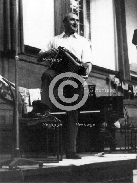Bob Roberts playing the melodion, Cecil Sharp House, London, October 1957. Artist: Eddis Thomas
