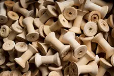 Bobbins for cotton reels awaiting waxing, Stott Park Bobbin Mill, Cumbria, c2014. Artist: Alun Bull