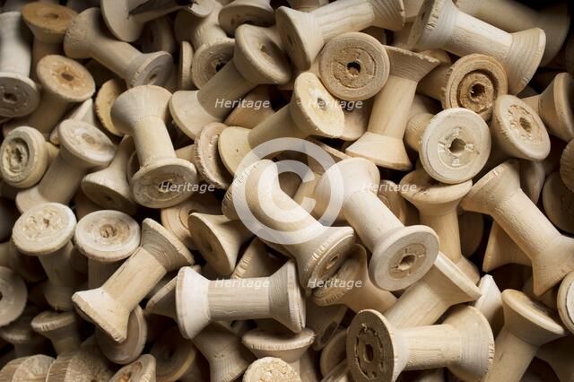 Bobbins for cotton reels awaiting waxing, Stott Park Bobbin Mill, Cumbria, c2014. Artist: Alun Bull.