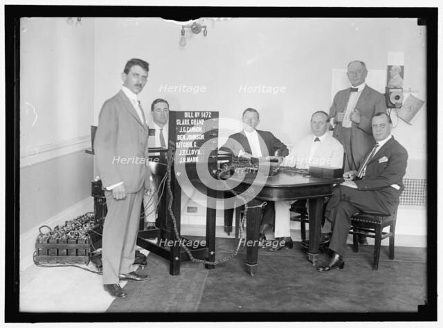 Bobroff voting machine being considered for use in house, between 1910 and 1917. Creator: Harris & Ewing.