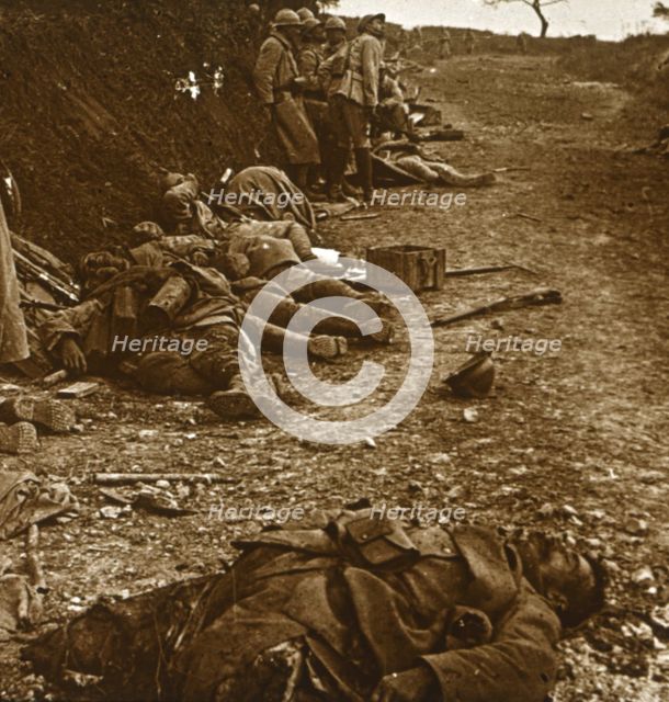Bodies after the taking of Courcelles, northern France, 1918. Artist: Unknown.