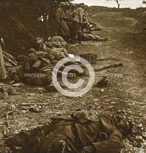 Bodies after the taking of Courcelles, northern France, 1918. Artist: Unknown.