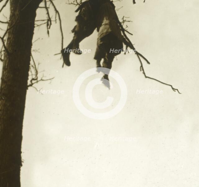 Body in tree, Bois d'Avocourt, Verdun, northern France, c1914-c1918.  Artist: Unknown.