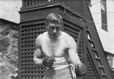 Bombardier Billy Wells, English boxer, preparing in Rye, N.Y., for fight with Al Panzer, 1912. Creator: Bain News Service