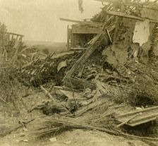 Bombed out building, body of dead soldier in foreground, 1916